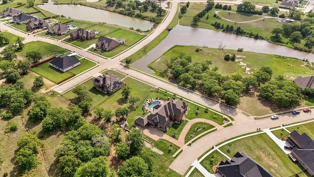 bird's eye view featuring a water view and a residential view