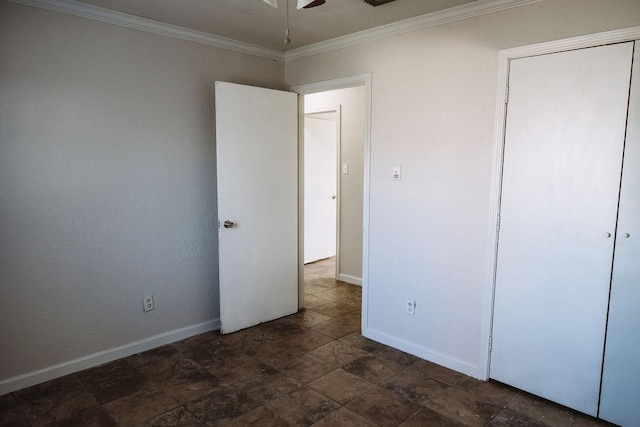 521 E 8th St, Bonham, TX 75418 - unfurnished bedroom with baseboards, ornamental molding, and stone finish floor