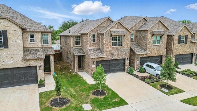 3045 Hamilton St, Plano, TX 75075 - townhome / multi-family property with concrete driveway, brick siding, a front yard, and a garage