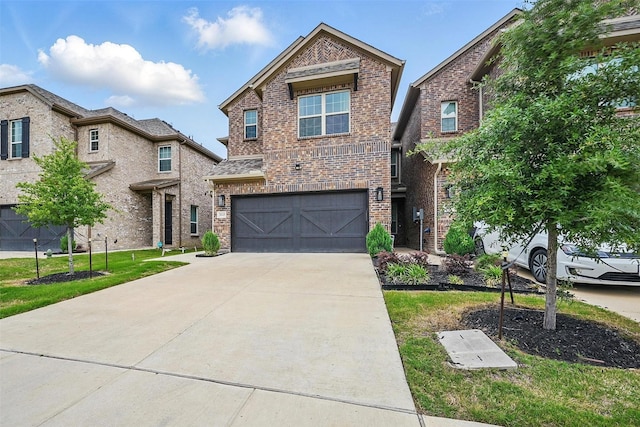 3045 Hamilton St, Plano, TX 75075 - view of front of property featuring driveway, brick siding, and an attached garage