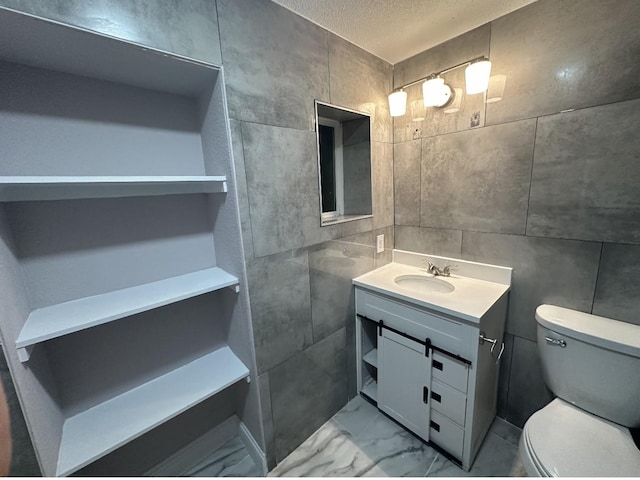 414 Ussery, Bowie, TX 76230 - bathroom with toilet, marble finish floor, vanity, and a textured ceiling