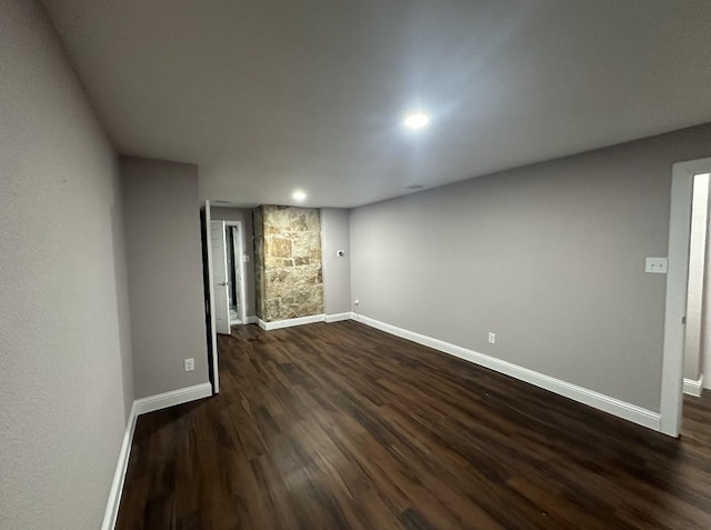 414 Ussery, Bowie, TX 76230 - spare room featuring dark wood finished floors, baseboards, and recessed lighting