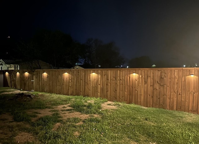 414 Ussery, Bowie, TX 76230 - yard at night with fence