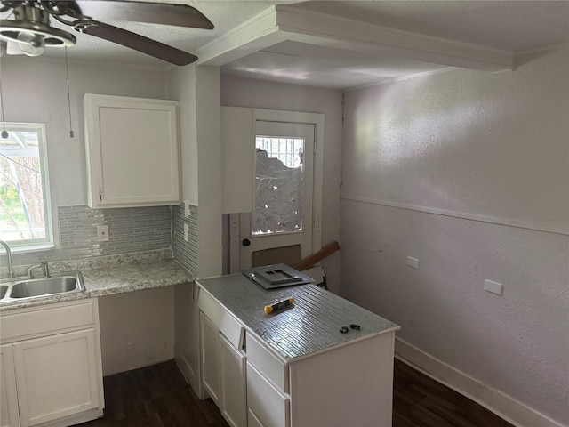 3616 Ave Ave N, Fort Worth, TX 76105 - kitchen featuring white cabinets, dark wood finished floors, plenty of natural light, and a sink