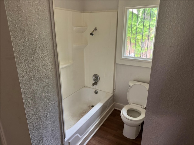 3616 Ave Ave N, Fort Worth, TX 76105 - full bathroom featuring toilet, wood finished floors, baseboards, and a textured wall