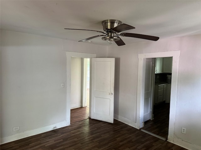 3616 Ave Ave N, Fort Worth, TX 76105 - spare room featuring baseboards, dark wood-style floors, and a ceiling fan