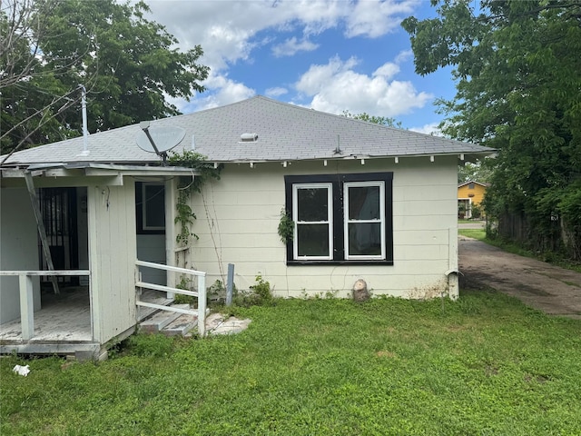 3616 Ave Ave N, Fort Worth, TX 76105 - back of house with roof with shingles and a lawn