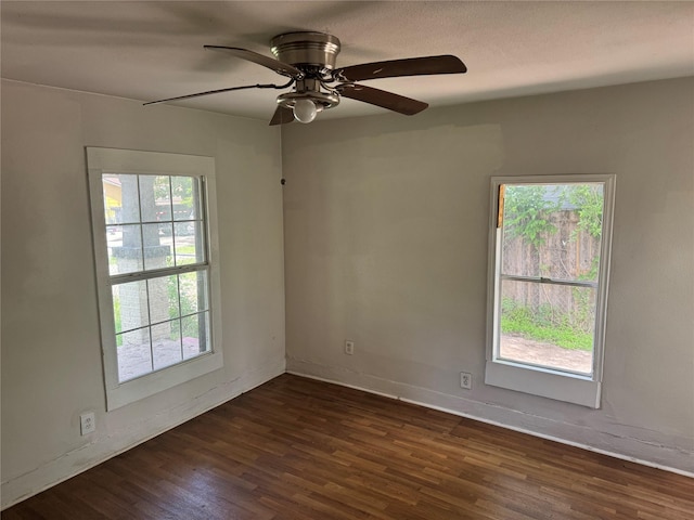 3616 Ave Ave N, Fort Worth, TX 76105 - empty room featuring dark wood-style flooring, baseboards, and a ceiling fan