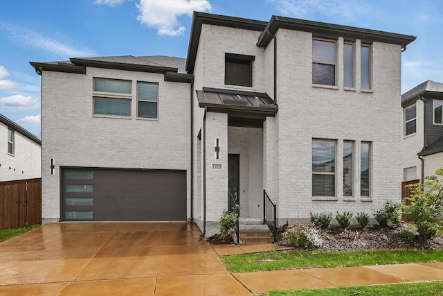 13101 Scissortail Dr, Frisco, TX 75035 - view of front of house with an attached garage, brick siding, concrete driveway, entry steps, and a standing seam roof