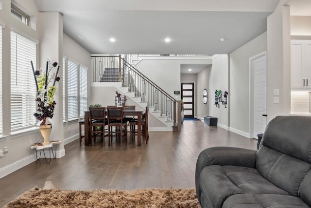 13101 Scissortail Dr, Frisco, TX 75035 - living room with stairs, wood-type flooring, baseboards, and recessed lighting
