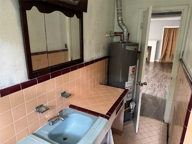 bathroom with tile walls and gas water heater