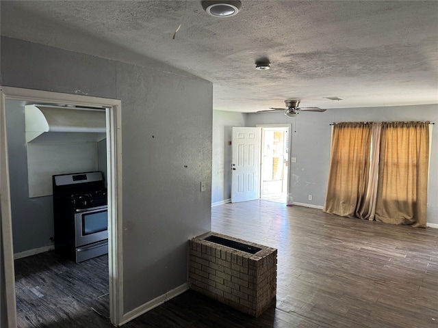 interior space with dark wood finished floors and a textured ceiling