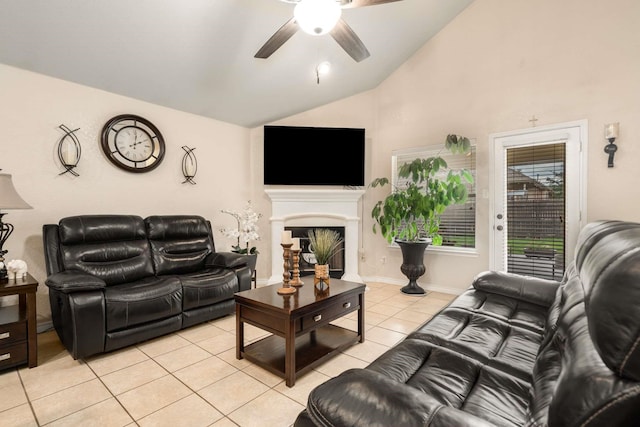 6113 Tilapia Dr, Fort Worth, TX 76179 - living room featuring light tile patterned floors, lofted ceiling, ceiling fan, and a fireplace