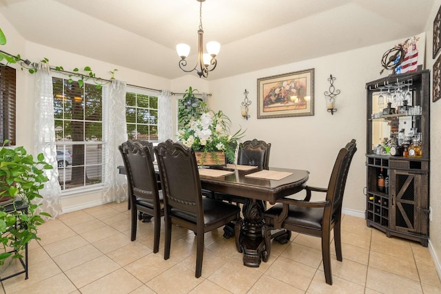 6113 Tilapia Dr, Fort Worth, TX 76179 - dining area with light tile patterned floors, baseboards, and a chandelier