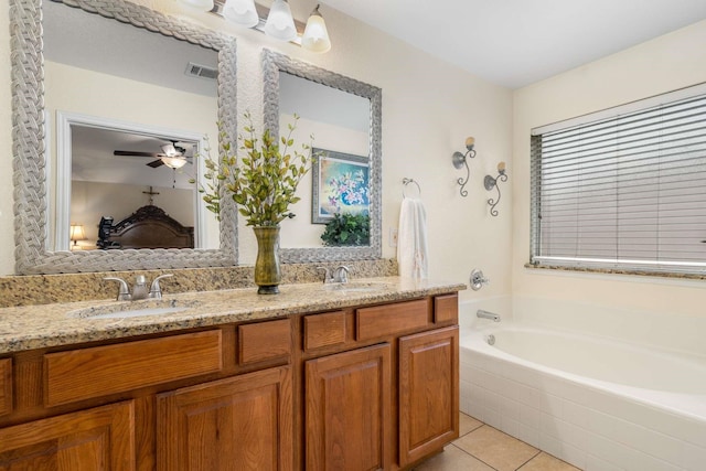6113 Tilapia Dr, Fort Worth, TX 76179 - bathroom with double vanity, a bath, tile patterned floors, and ceiling fan