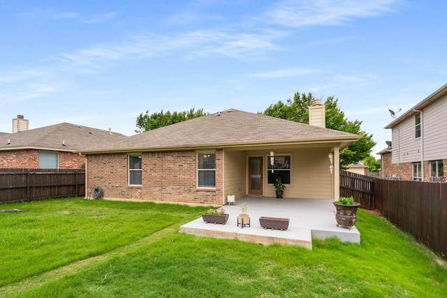 6113 Tilapia Dr, Fort Worth, TX 76179 - back of property with a patio, brick siding, a chimney, and a shingled roof