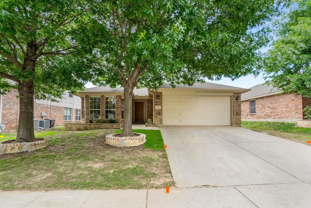 6113 Tilapia Dr, Fort Worth, TX 76179 - view of front facade with an attached garage, concrete driveway, cooling unit, and brick siding