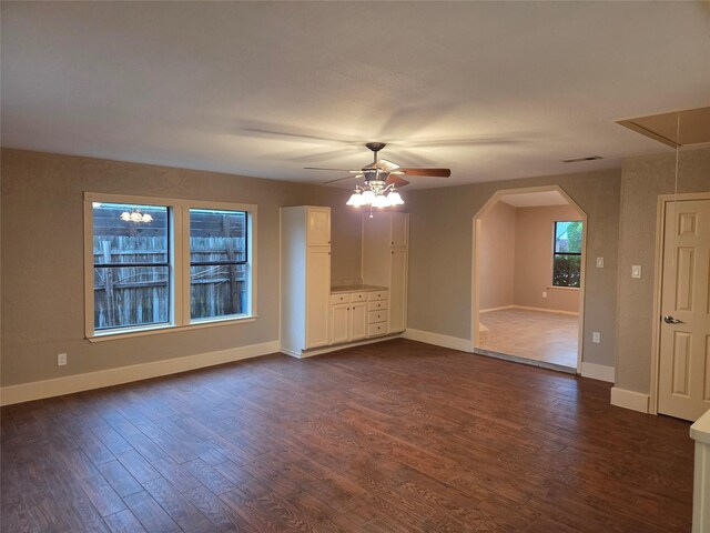 2149 Pueblo Dr, Garland, TX 75040 - unfurnished room featuring baseboards, ceiling fan, and dark wood-style floors