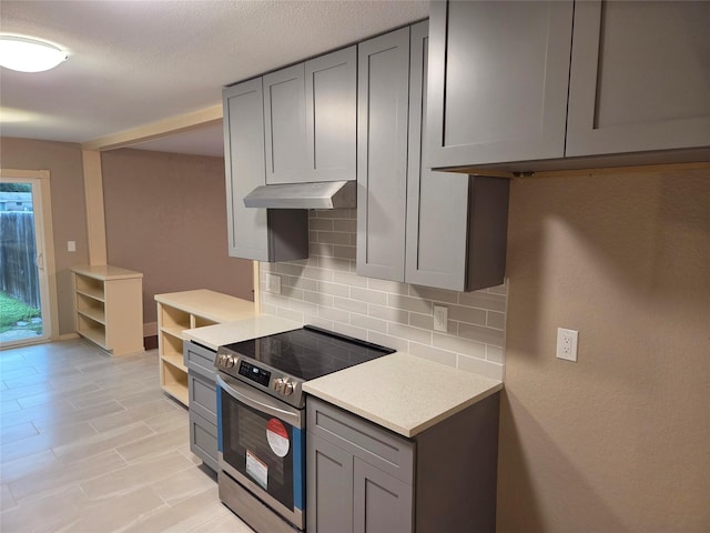 2149 Pueblo Dr, Garland, TX 75040 - kitchen featuring open shelves, gray cabinetry, stainless steel electric stove, and backsplash
