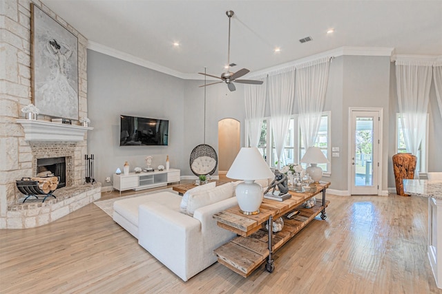 621 E Fm 550, Mclendon Chisholm, TX 75032 - living area with wood finished floors, visible vents, a fireplace, crown molding, and a ceiling fan