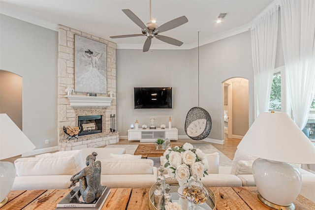 621 E Fm 550, Mclendon Chisholm, TX 75032 - living area with crown molding, baseboards, a ceiling fan, and arched walkways