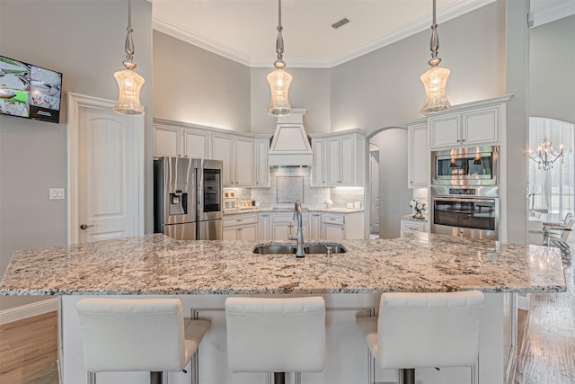 621 E Fm 550, Mclendon Chisholm, TX 75032 - kitchen featuring appliances with stainless steel finishes, visible vents, a sink, light wood-type flooring, and a high ceiling