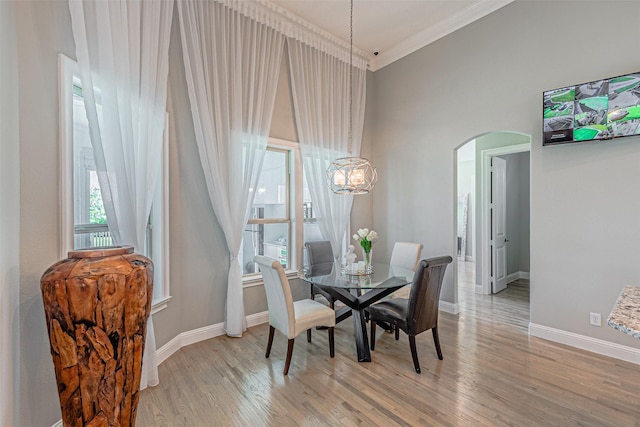 621 E Fm 550, Mclendon Chisholm, TX 75032 - dining space with ornamental molding, light wood-type flooring, a chandelier, arched walkways, and baseboards
