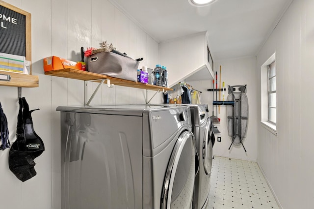 1601 E Bankhead Dr, Weatherford, TX 76086 - laundry area featuring washer and clothes dryer, light floors, baseboards, and crown molding