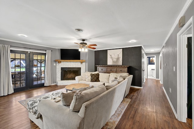 1601 E Bankhead Dr, Weatherford, TX 76086 - living room featuring ornamental molding, a ceiling fan, baseboards, dark wood-type flooring, and french doors