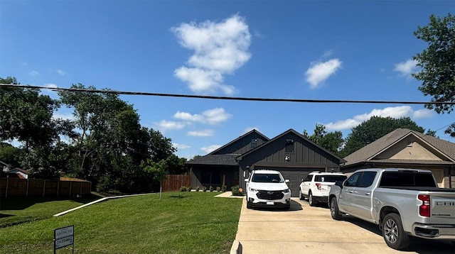 2631 Fish Tank Rd, Corsicana, TX 75110 - view of front facade featuring a garage, concrete driveway, and board and batten siding