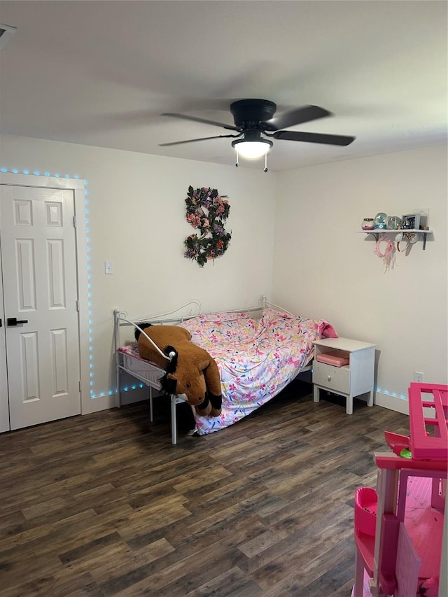 2631 Fish Tank Rd, Corsicana, TX 75110 - bedroom featuring wood finished floors, a ceiling fan, and baseboards