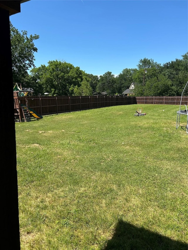 2631 Fish Tank Rd, Corsicana, TX 75110 - view of yard with a trampoline and a playground