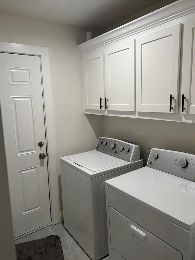 2631 Fish Tank Rd, Corsicana, TX 75110 - laundry room featuring marble finish floor, separate washer and dryer, and cabinet space