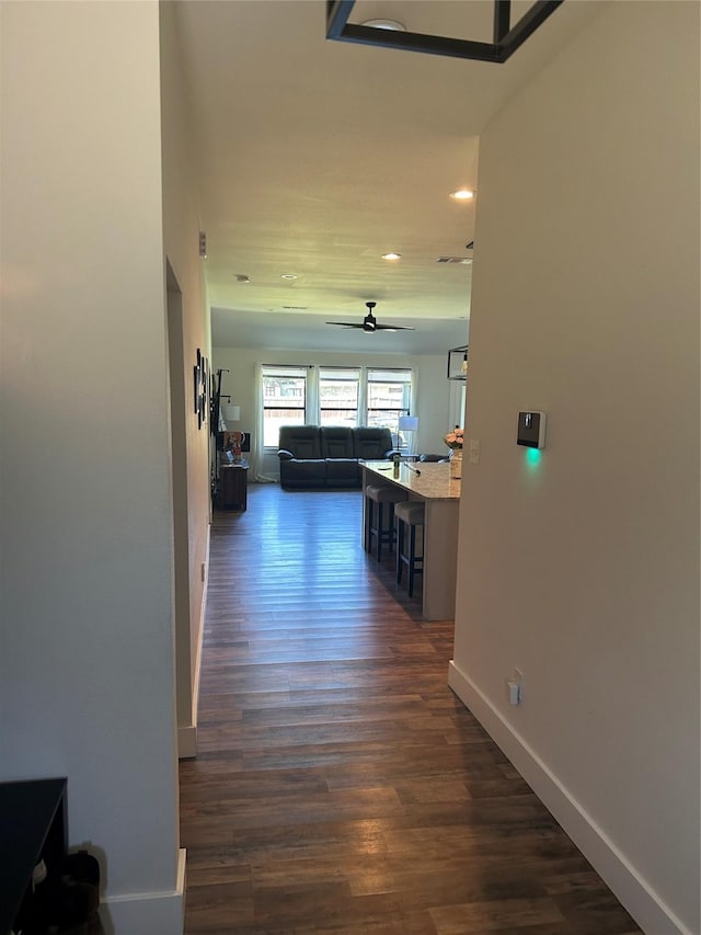 2631 Fish Tank Rd, Corsicana, TX 75110 - corridor featuring recessed lighting, dark wood-style floors, and baseboards
