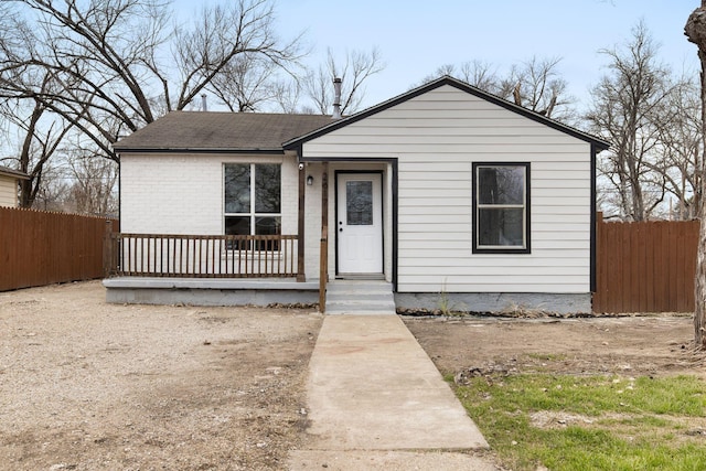 2617 Fordham Rd, Dallas, TX 75216 - view of front of property featuring a shingled roof, brick siding, and fence