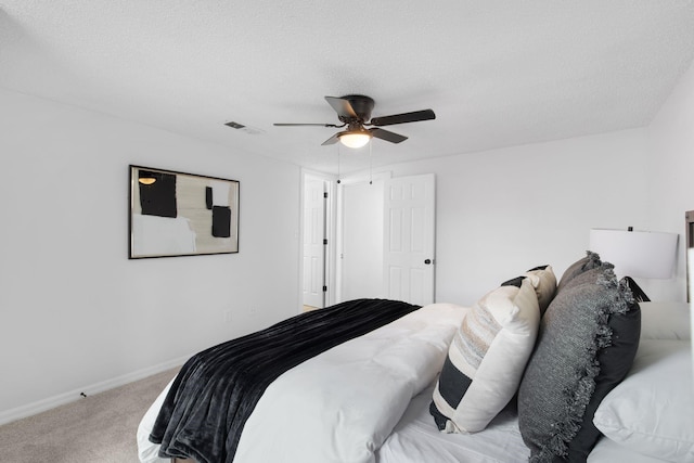 2617 Fordham Rd, Dallas, TX 75216 - bedroom featuring a ceiling fan, carpet floors, a textured ceiling, visible vents, and baseboards