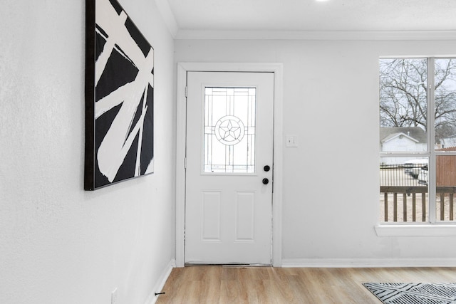 2617 Fordham Rd, Dallas, TX 75216 - entrance foyer featuring plenty of natural light, light wood-style flooring, baseboards, and ornamental molding