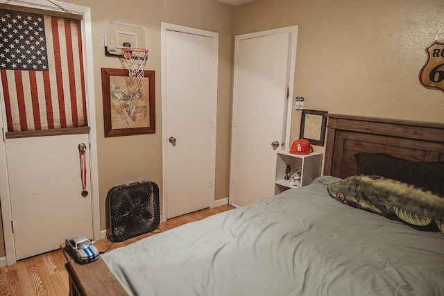 204 County Road 2211, Ivanhoe, TX 75447 - bedroom with light wood finished floors and baseboards