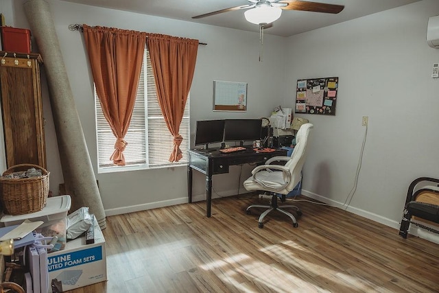 204 County Road 2211, Ivanhoe, TX 75447 - office space featuring a wall mounted air conditioner, baseboards, wood finished floors, and a ceiling fan