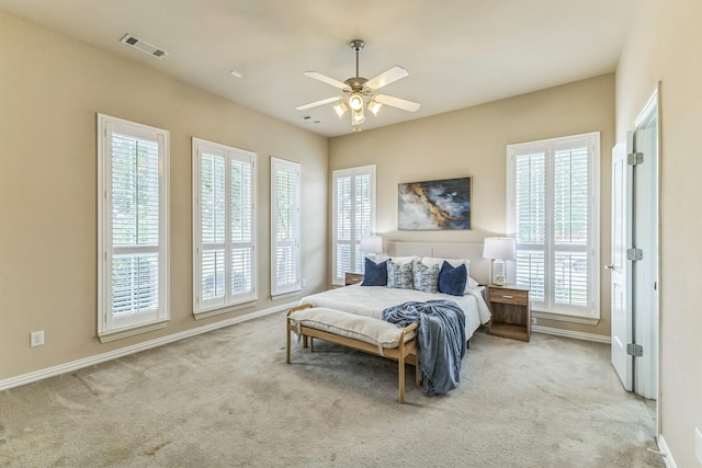 carpeted bedroom with baseboards and ceiling fan