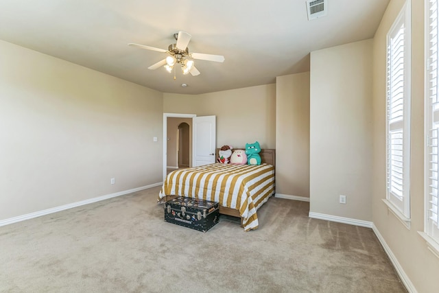 bedroom with carpet, baseboards, and ceiling fan