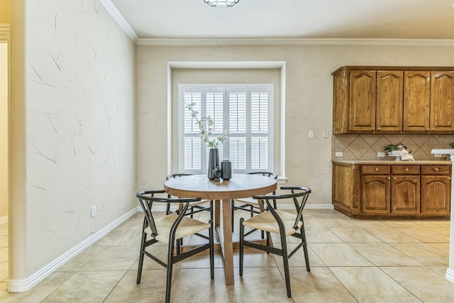 dining space with crown molding, light tile patterned floors, and baseboards