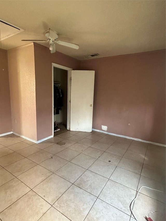 3819 N Terry St, Fort Worth, TX 76106 - unfurnished room with light tile patterned floors, ceiling fan, and baseboards