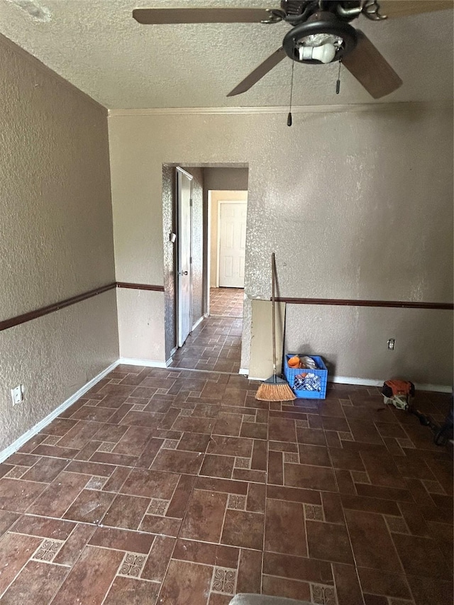 3819 N Terry St, Fort Worth, TX 76106 - spare room featuring a textured wall, a ceiling fan, baseboards, brick patterned flooring, and a textured ceiling