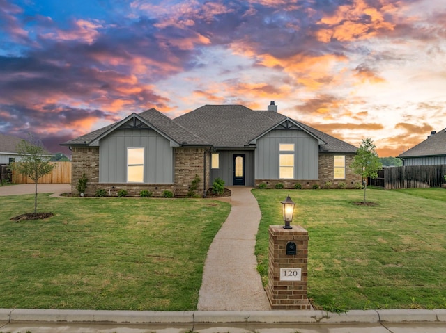120 Water View Ln, Robinson, TX 76706 - view of front of home featuring a shingled roof, board and batten siding, fence, and a lawn