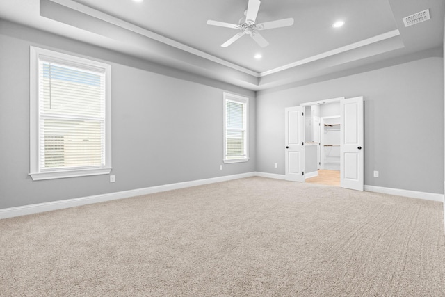 120 Water View Ln, Robinson, TX 76706 - unfurnished bedroom featuring light colored carpet, visible vents, baseboards, and a raised ceiling