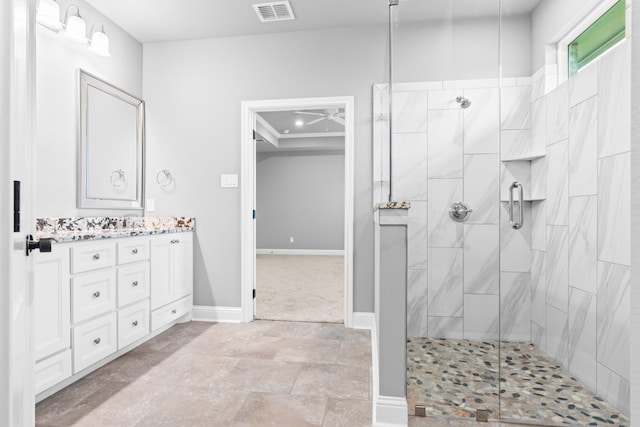 120 Water View Ln, Robinson, TX 76706 - full bathroom with baseboards, ceiling fan, visible vents, tiled shower, and vanity