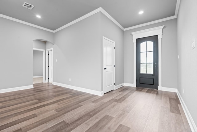 120 Water View Ln, Robinson, TX 76706 - foyer featuring wood finished floors, visible vents, baseboards, arched walkways, and ornamental molding