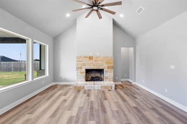 9008 Parkview Cir, Tolar, TX 76476 - unfurnished living room with a ceiling fan, a fireplace, visible vents, and wood finished floors