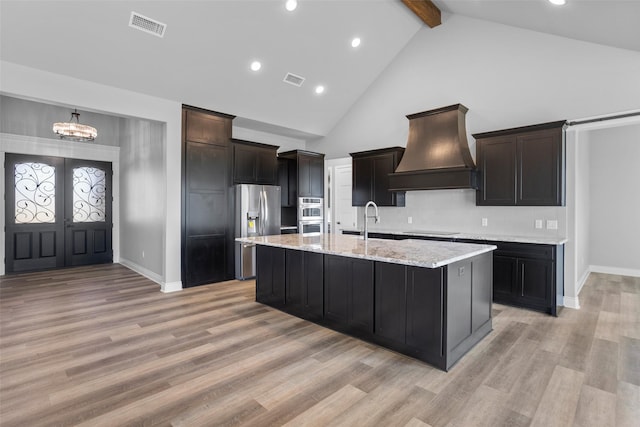 9008 Parkview Cir, Tolar, TX 76476 - kitchen featuring high vaulted ceiling, visible vents, beamed ceiling, appliances with stainless steel finishes, and premium range hood